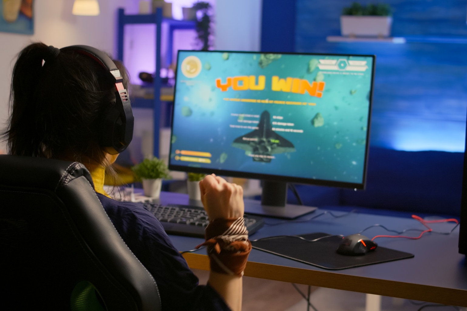 woman immersed in a game on her computer.