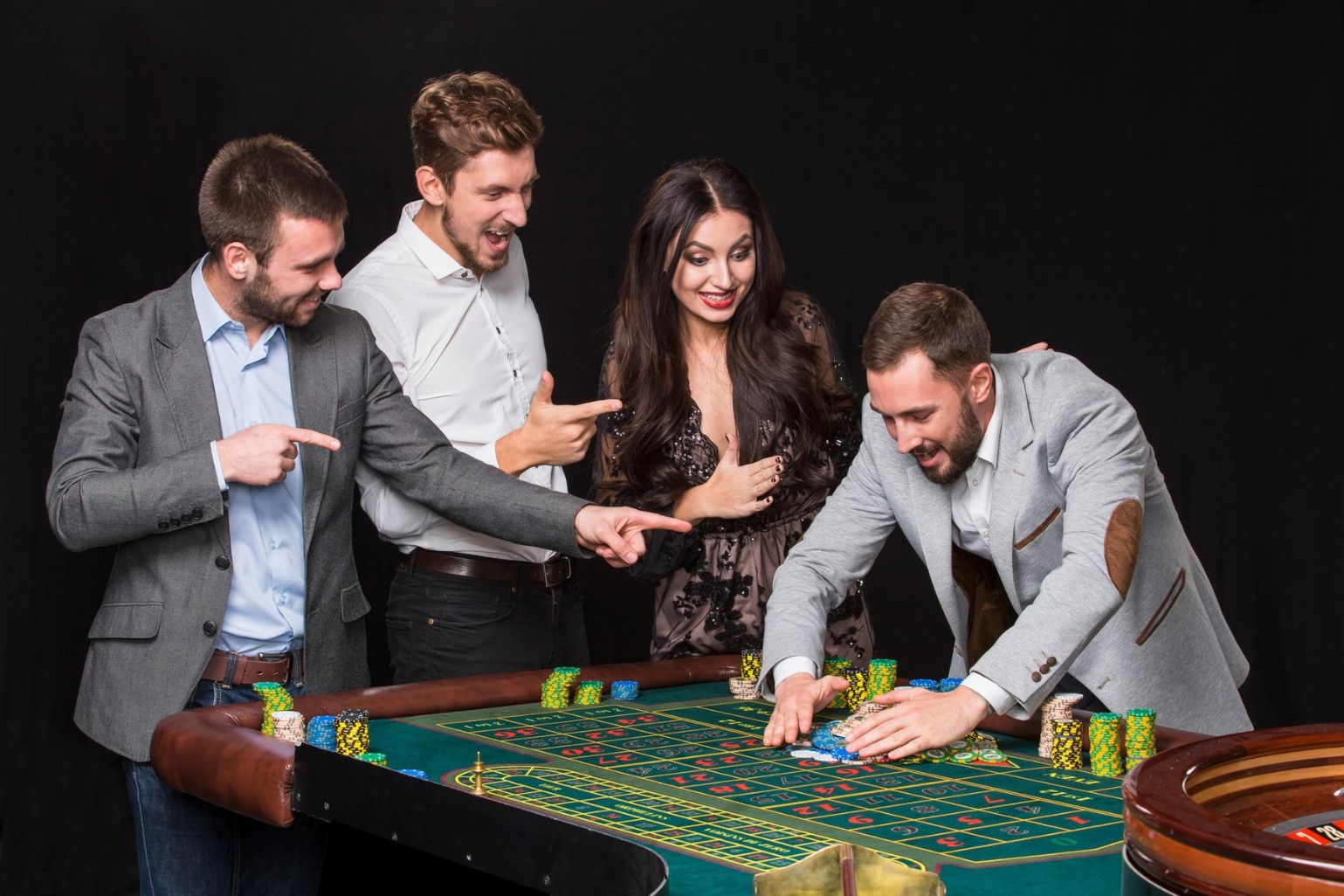 Bunch of people enjoying playing casino game